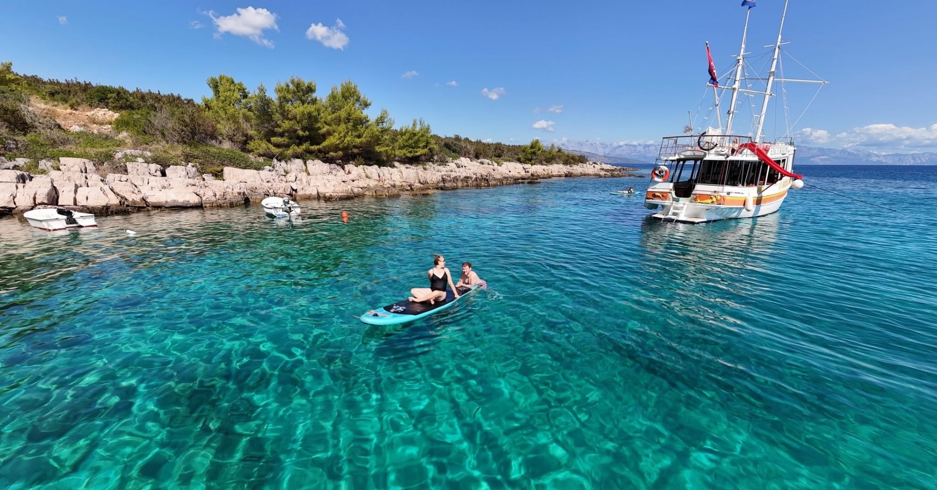 Paddleboarding off the boat